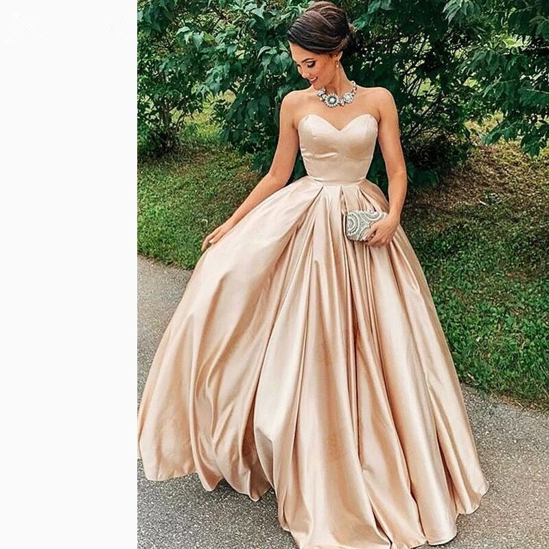 Puffy A Line Prom Dresses Lovely Sweetheart Backless Champagne Satin Party Wear Custom Made Floor Lenth Ruffle Princess Gown