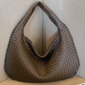 French high-end woven bag, versatile shoulder armpit bag, niche texture portable commuter bag